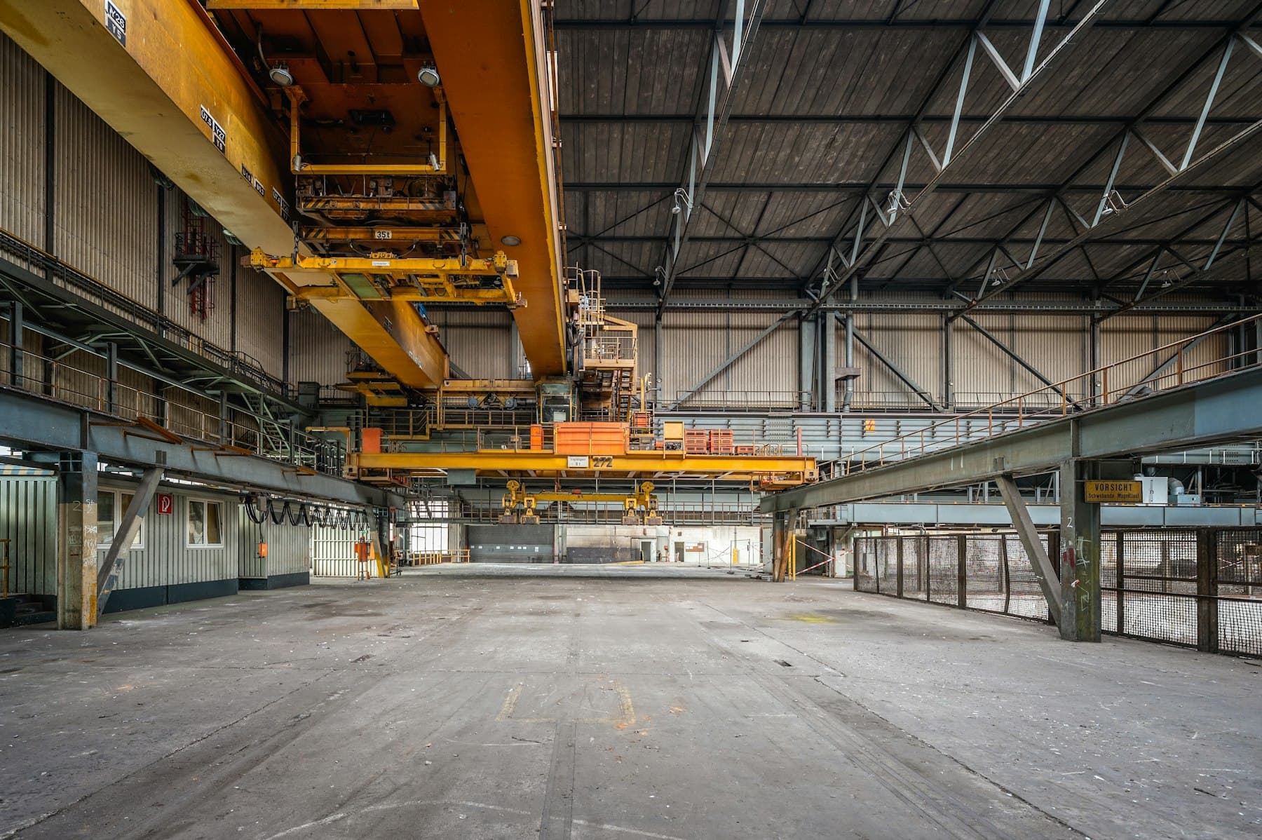 Large industrial hall with overhead cranes
